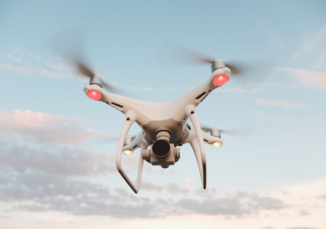 white-drone-hovering-in-a-bright-blue-sky-PMFRLG7.jpg white-drone-hovering-in-a-bright-blue-sky-PMFRLG7.jpg